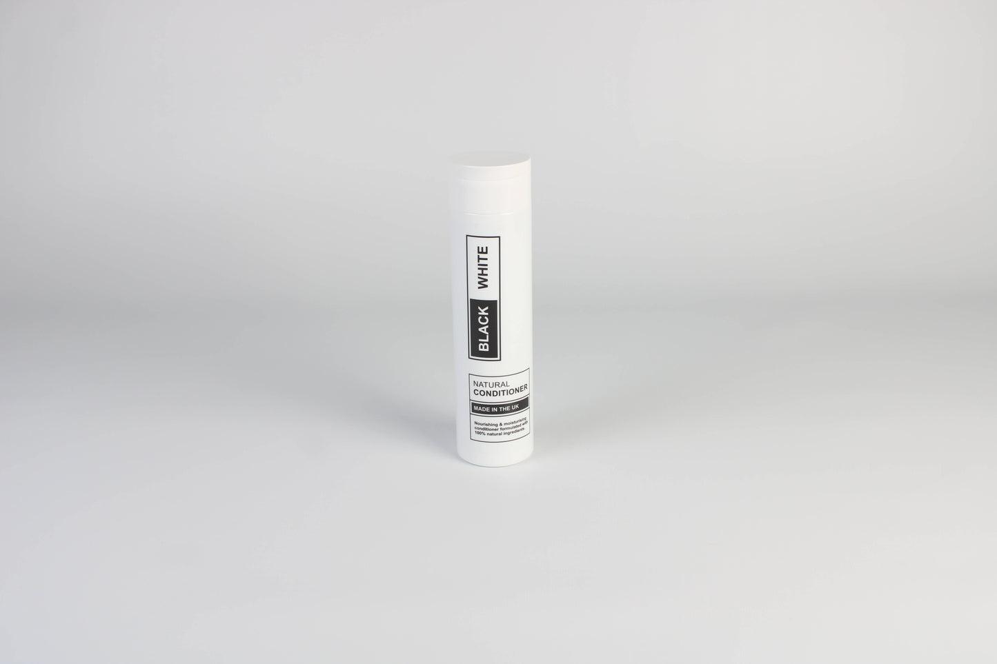 A photo of Black & White's Natural Conditioner against a white background.