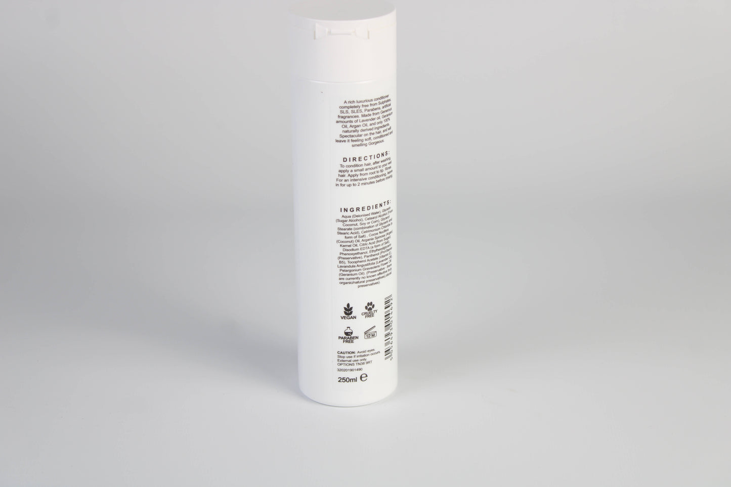 A photo of the back of Black & White's Natural Conditioner against a white background.