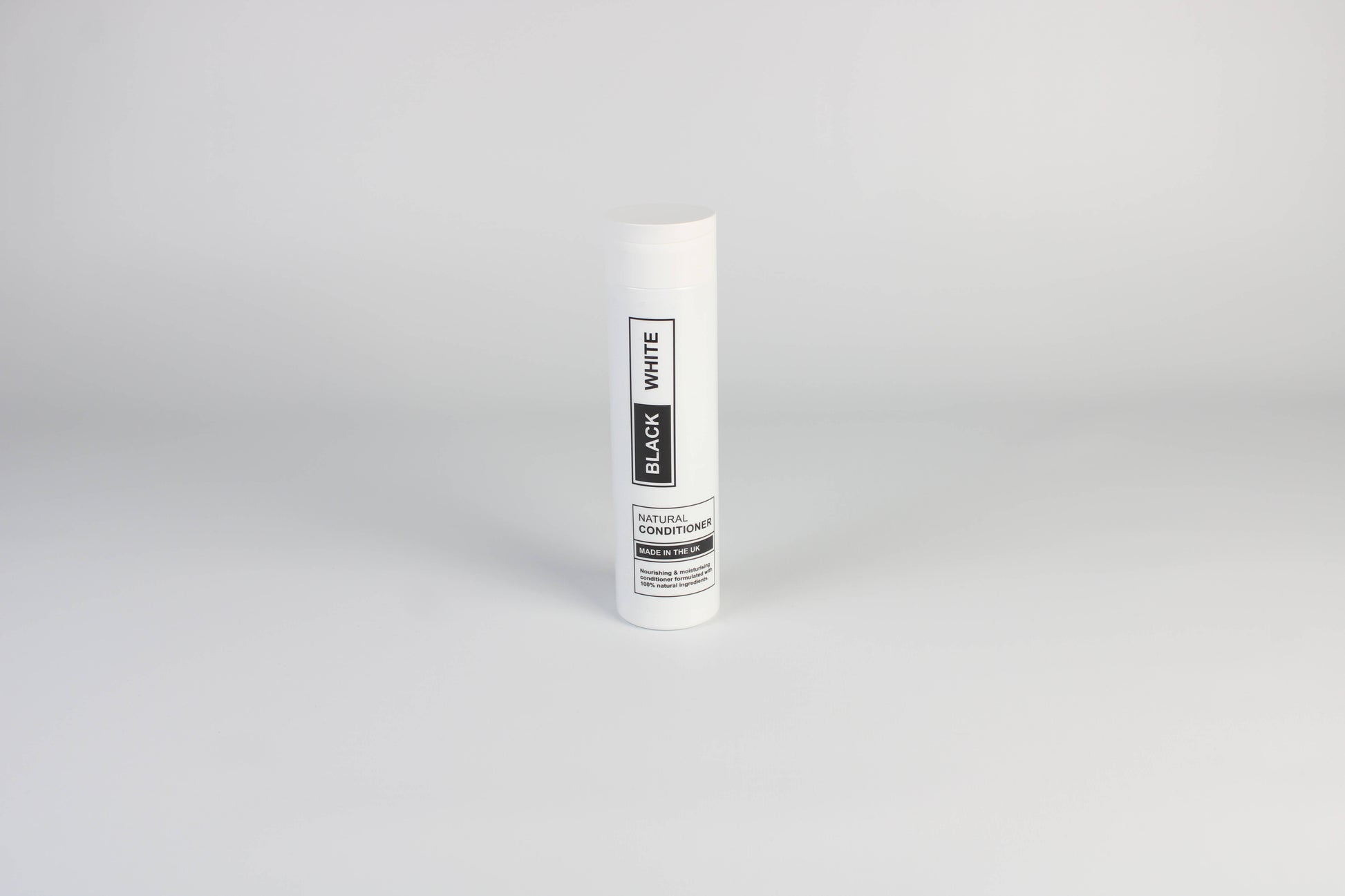 A photo of Black & White's Natural Conditioner against a white background. 